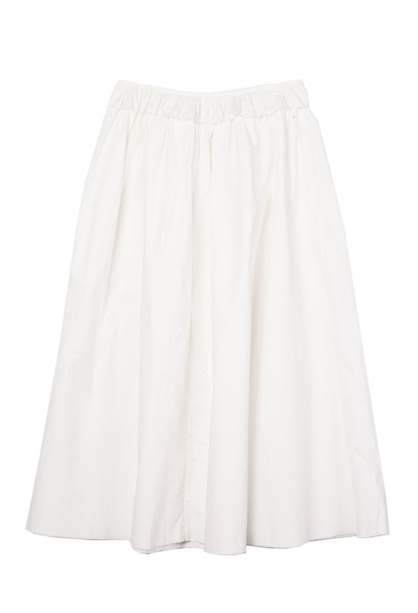 Long white skirt with ruffles along the waistline against white background. 