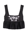 Cropped sleeveless black satin peplum top with floral embroidery on a white background