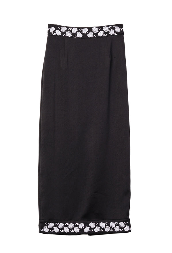Black satin skirt with white floral embroidery on the waist and hem on a white background