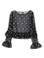 Black sheer blouse with embroidered floral pattern, ruffled sleeves at wrists and hem on a white background