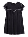 Black mini dress with cap sleeves and white floral embroidery across the chest, sleeve and hemline against white background.