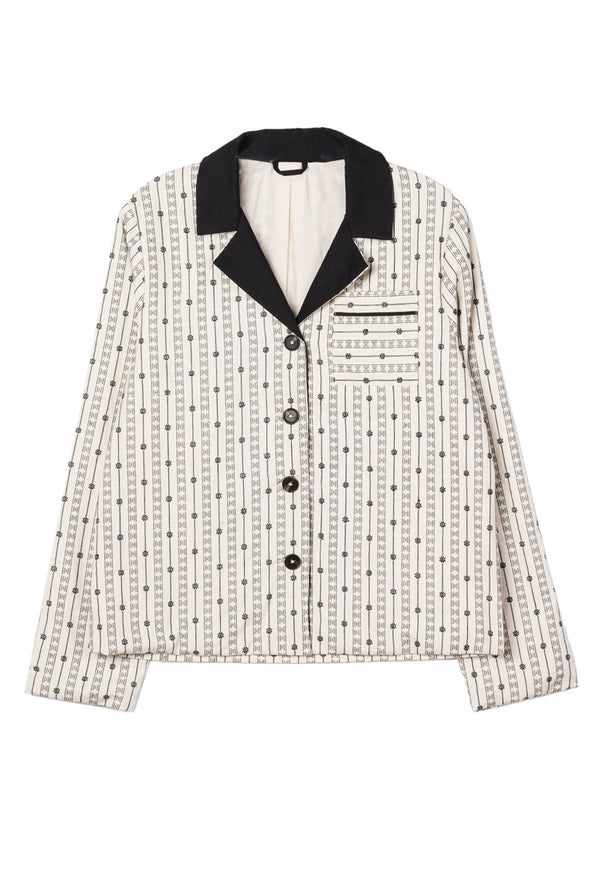 Off white jacket with black embroidery detailing, black collar and dark horn buttons on a white background