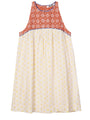 Mini length tank style shift dress with blood orange and white floral top and white skirt with yellow sun pattern on a white background