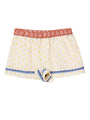 White boxer briefs with yellow sun pattern and blood orange waistband with flowers and blue hem detail on a white background