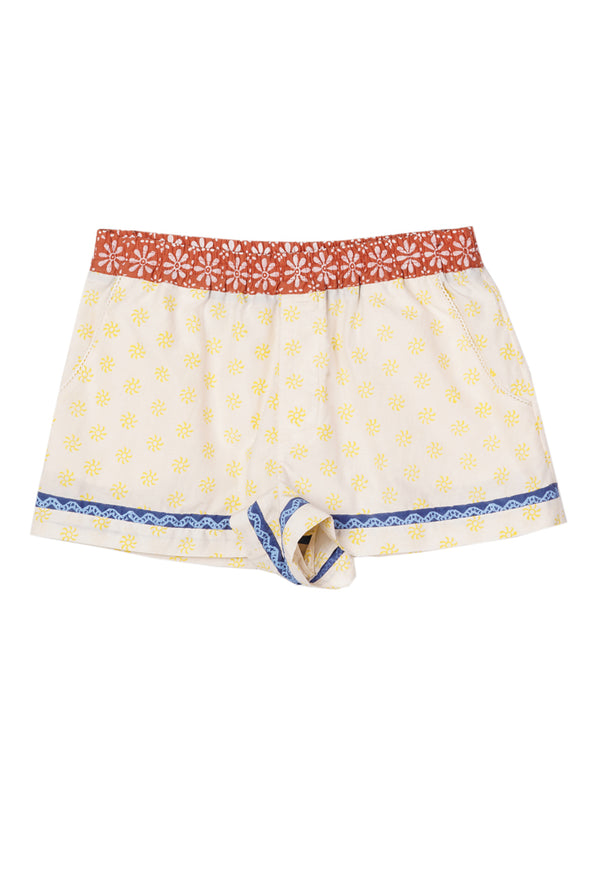 White boxer briefs with yellow sun pattern and blood orange waistband with flowers and blue hem detail on a white background