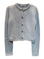Light blue knitted button down cardigan with chunky braided trim details against a white background. 